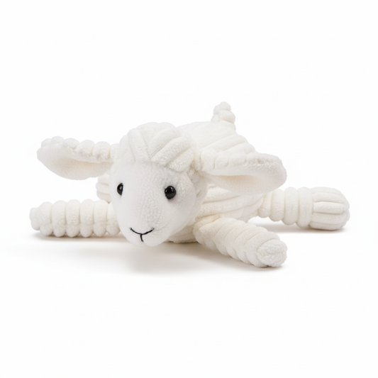 White sheep plushie lying on stomach with accurate face